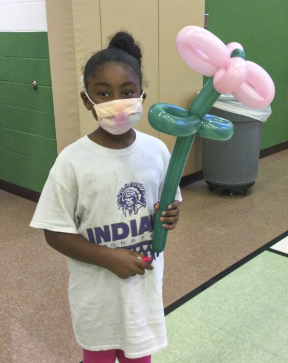 Girl with a flower balloon