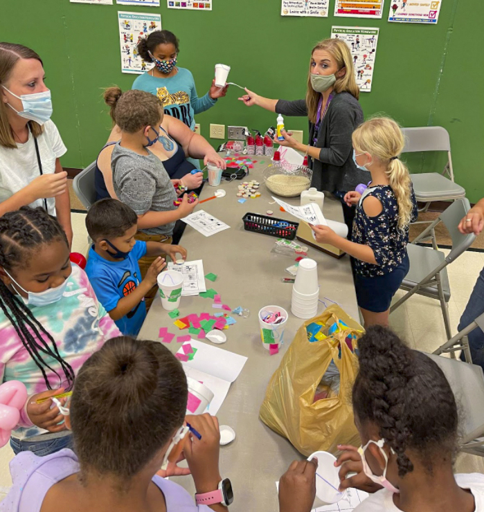 Students and parents working on crafts