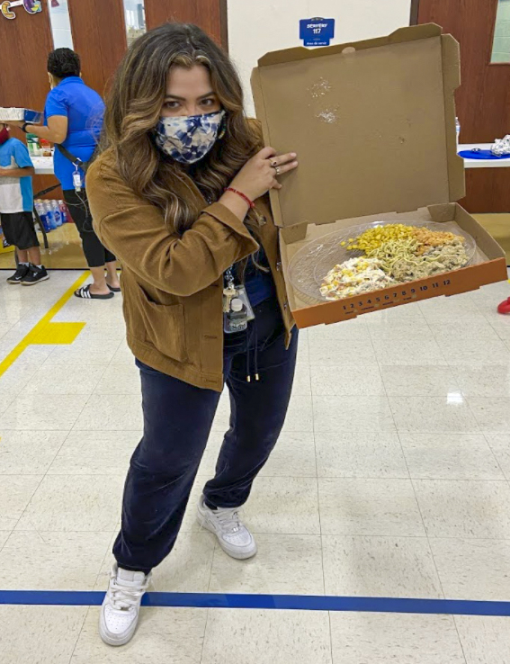 Staff holding pizza box