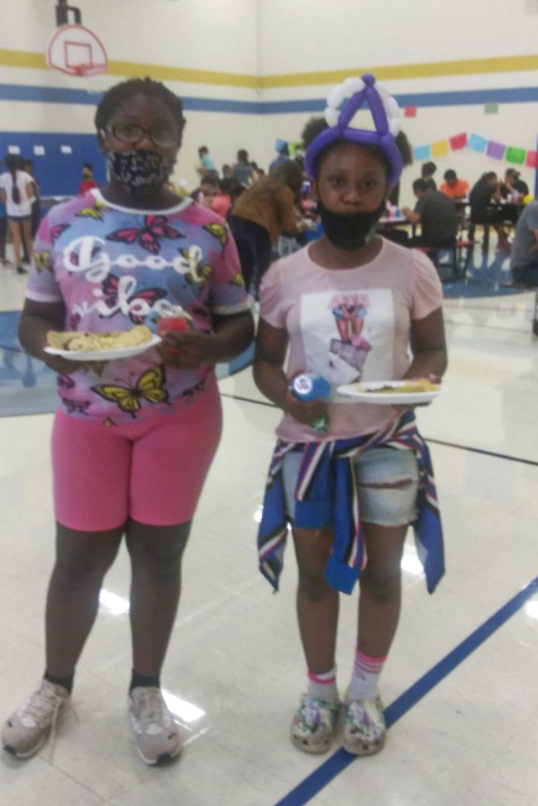 Two girls posing for a picture