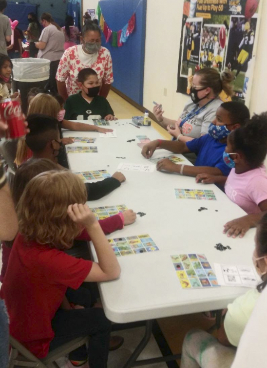 Students playing loteria at a table
