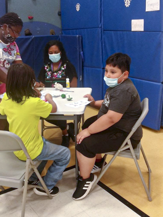 Students playing a table top game