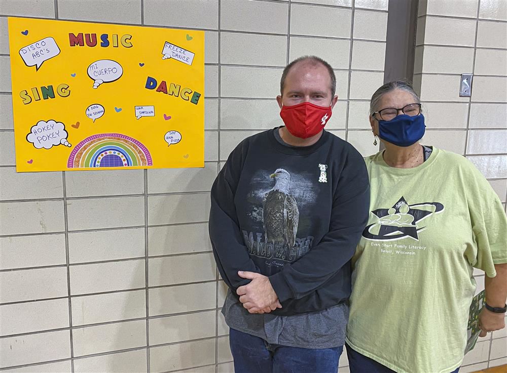 2 Adults posing for a picture