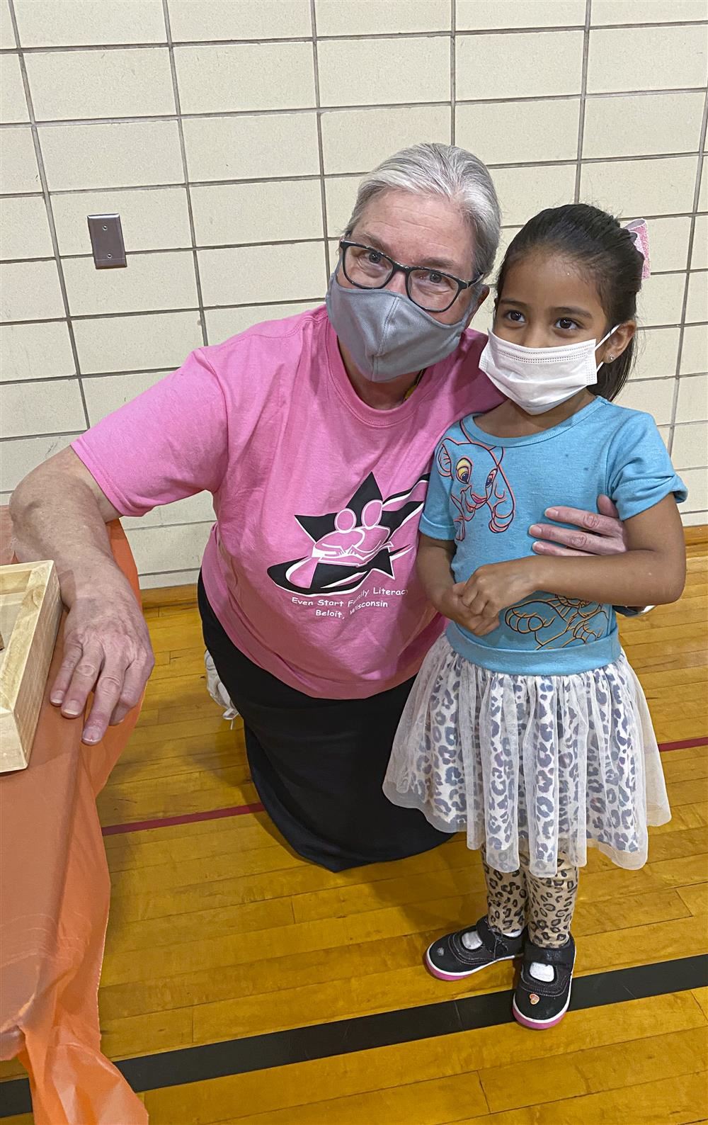 Teacher and student posing for a photo