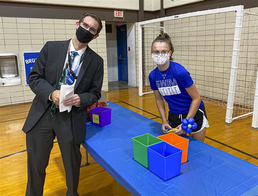 Superintendent and teen posing for a picture