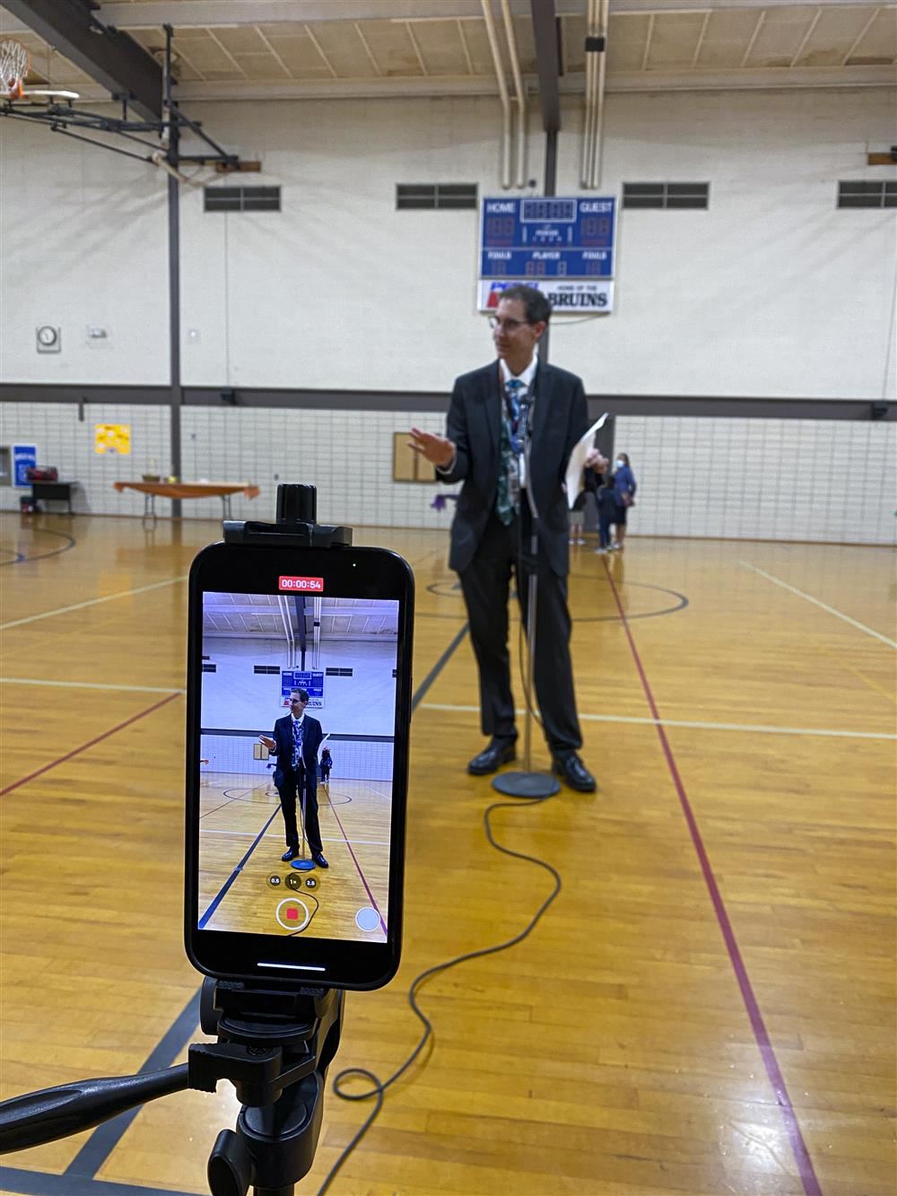 Superintendent speaking with a mic