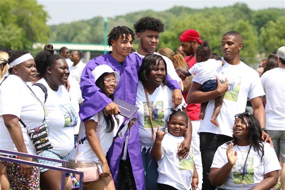 Graduation Picture - family taking a picture with a graduate